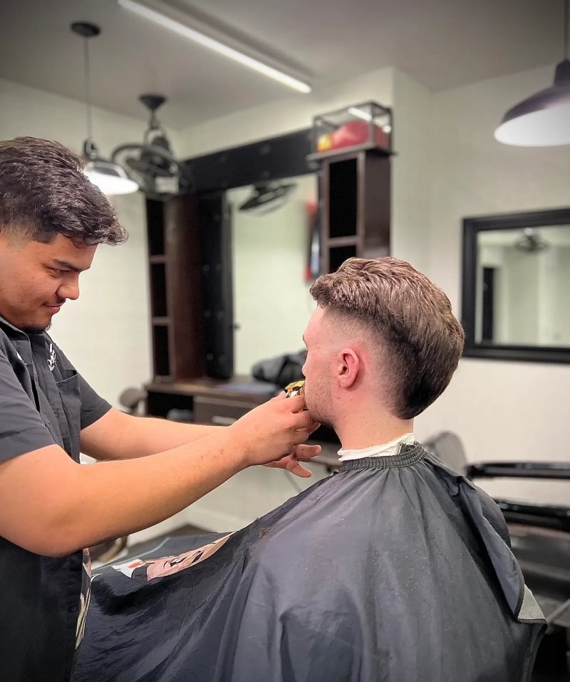 Man getting a haircut in barbershop